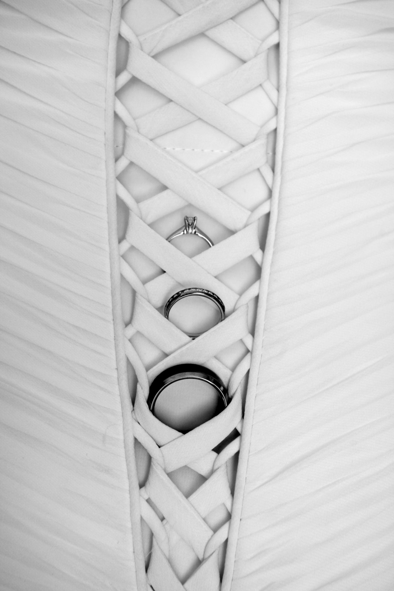 wedding rings in the back of bridal dress