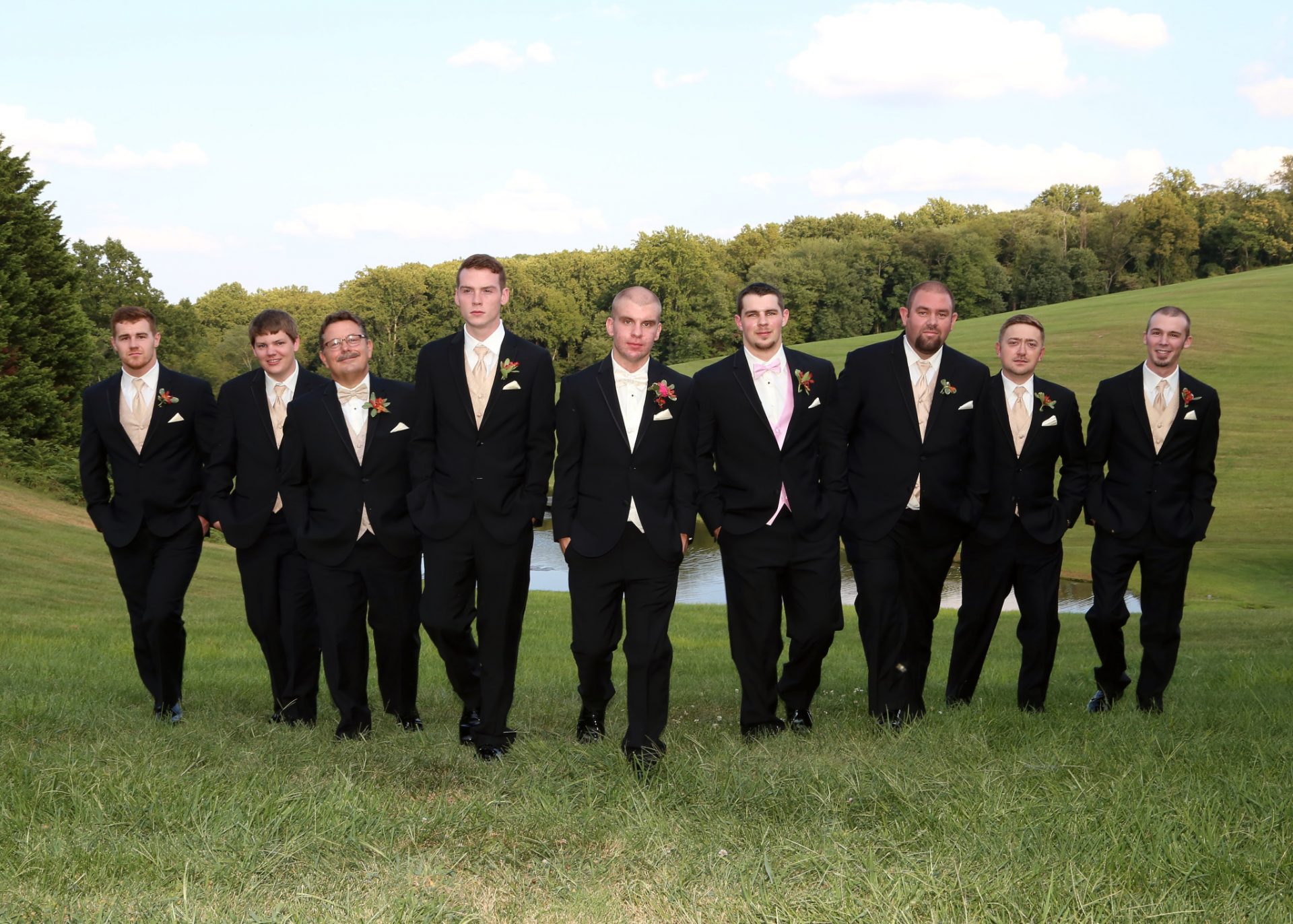 Groom and Groom's men pose outside of groom's room before the outdoor wedding in Maryland