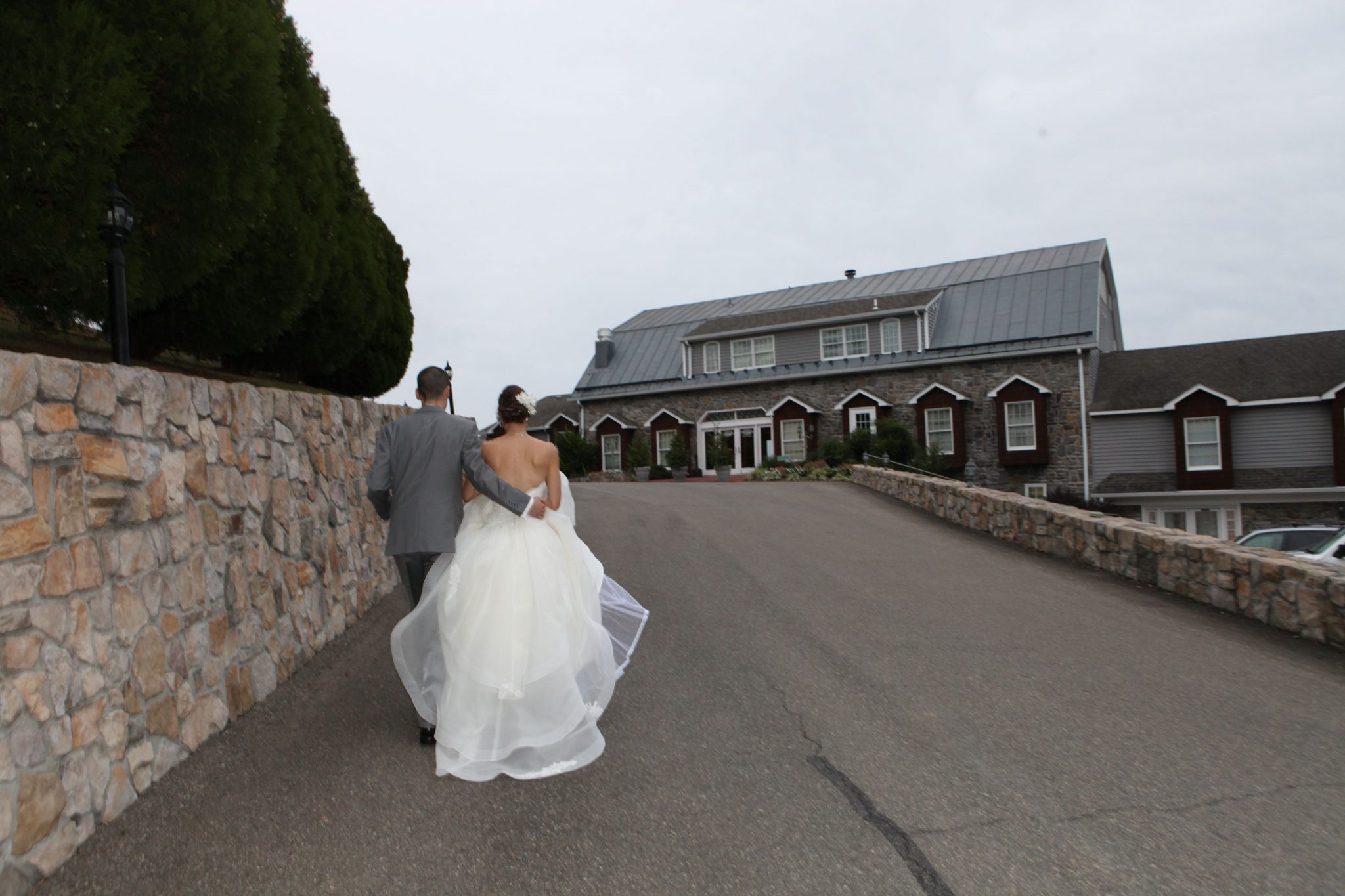 Bride and groom walking back to the entrance of Morningside Inn